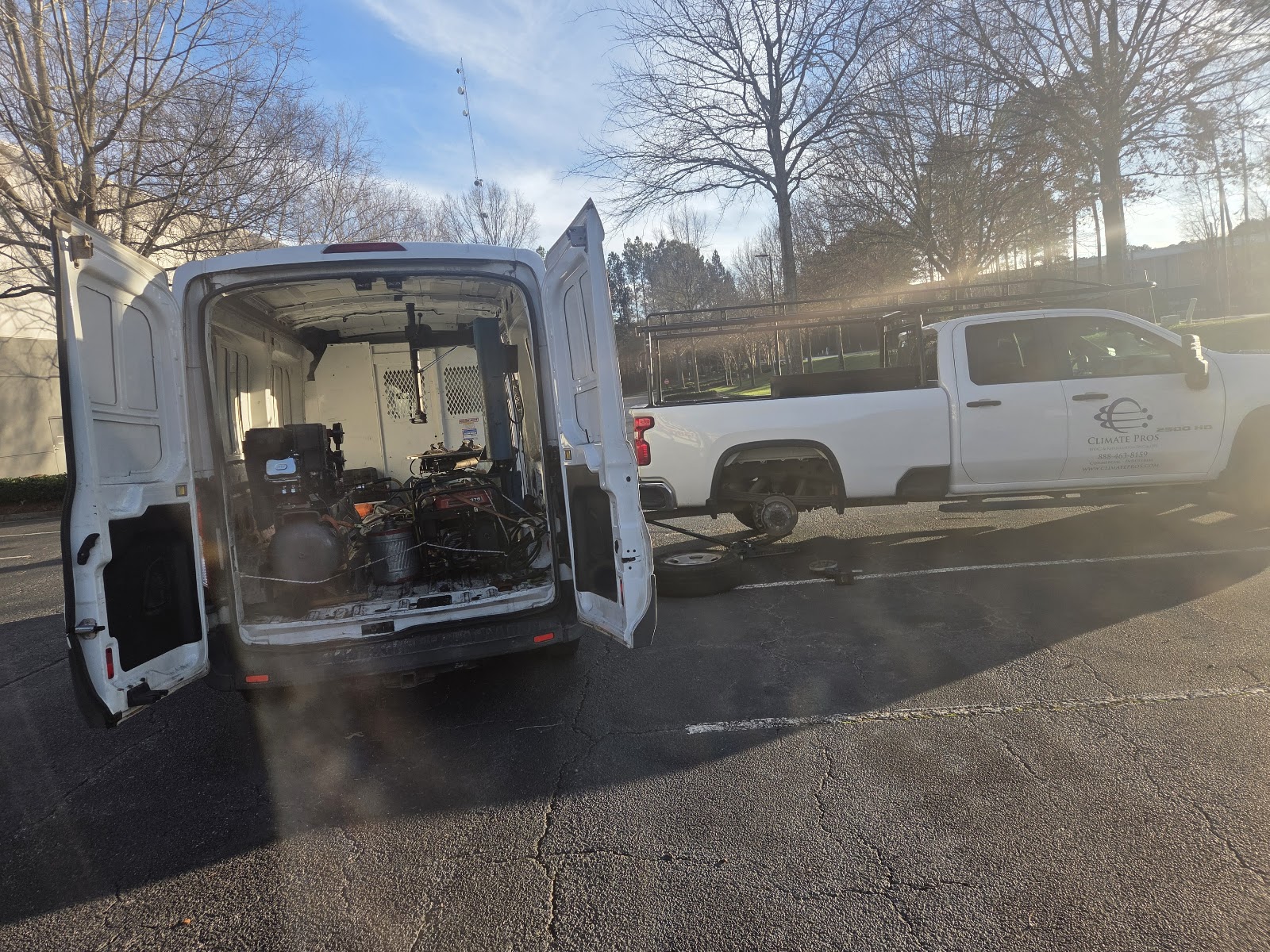 Zion Mobile Tire Services — mobile service van with rear doors open and a customer's pickup truck having its rear wheel removed